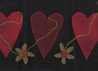 Red Wool Hearts on Black Wool Background