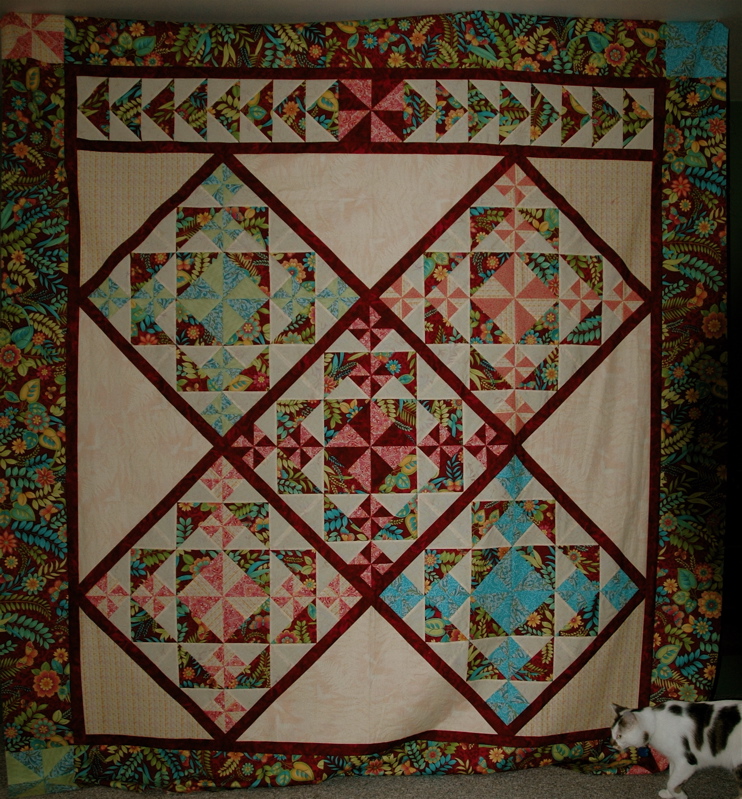 Block name: Spinners. From The Thimbleberries Guild for Weekend Quilters. This is so not Thimbleberries fabric!